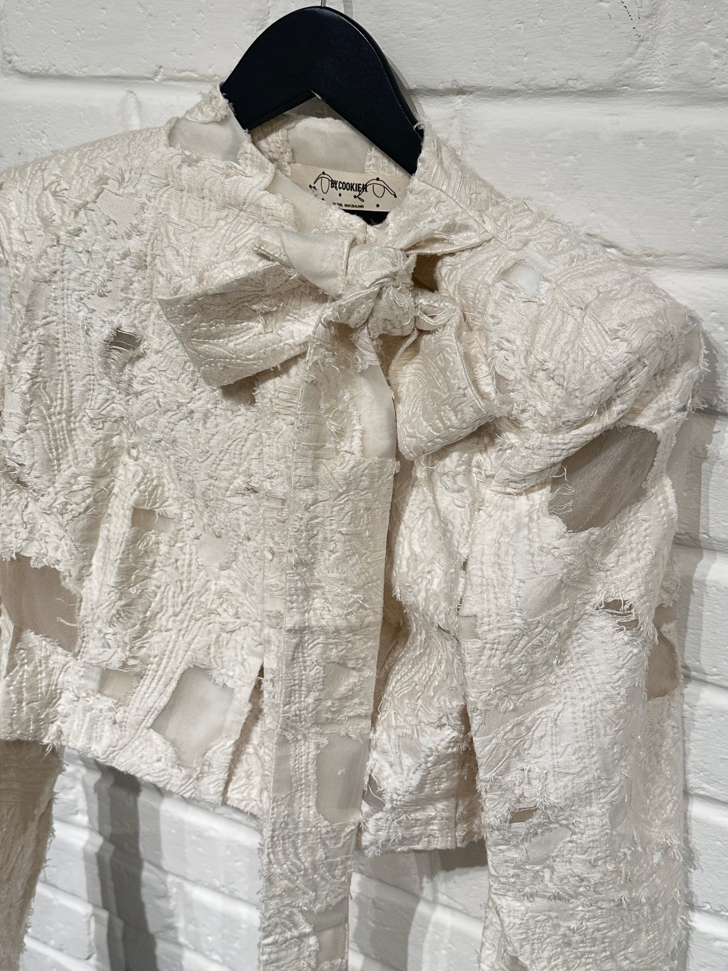 By Cookie H. Cropped Suit the Bow